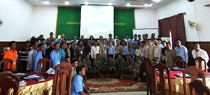 Photo of workshop participants assembled on the stage of the conference hall.